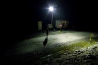 Melissa Troutman approaching a guard shack in Tioga State Forest. photo: Joshua B. Pribanic